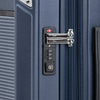 Close-up of a blue suitcase with a lock mechanism