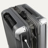 Top view of Travelpro Platinum Elite Hardside Spinner in Vintage Grey, showing USB Charging Port and built-in battery pocket.