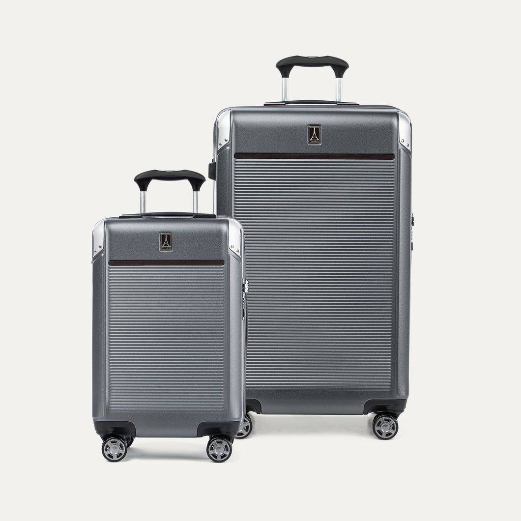 A set of two Platinum Elite hardside spinner suitcases, one carry-on and one large check-in size, in a vintage grey color with textured finish, metal corner armor and a four-stop adjustable handle.