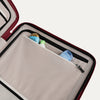 Close-up of a open suitcase interior compartment with toiletries inside.