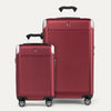 A set of two red hardside spinner suitcases, one carry-on and one check-in size, with the travelpro logo visible