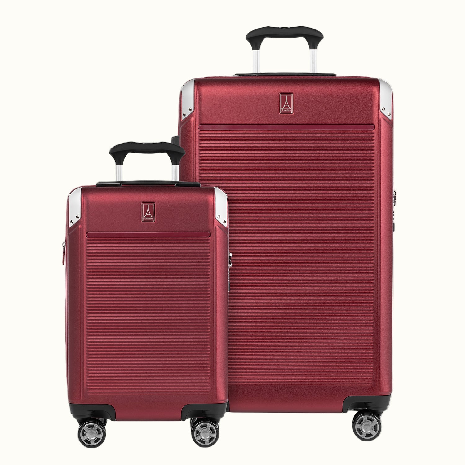 A set of two red hardside spinner suitcases, one carry-on and one check-in size, with the travelpro logo visible