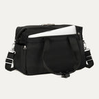 Black tote with a laptop in the padded sleeve compartment on a white background 