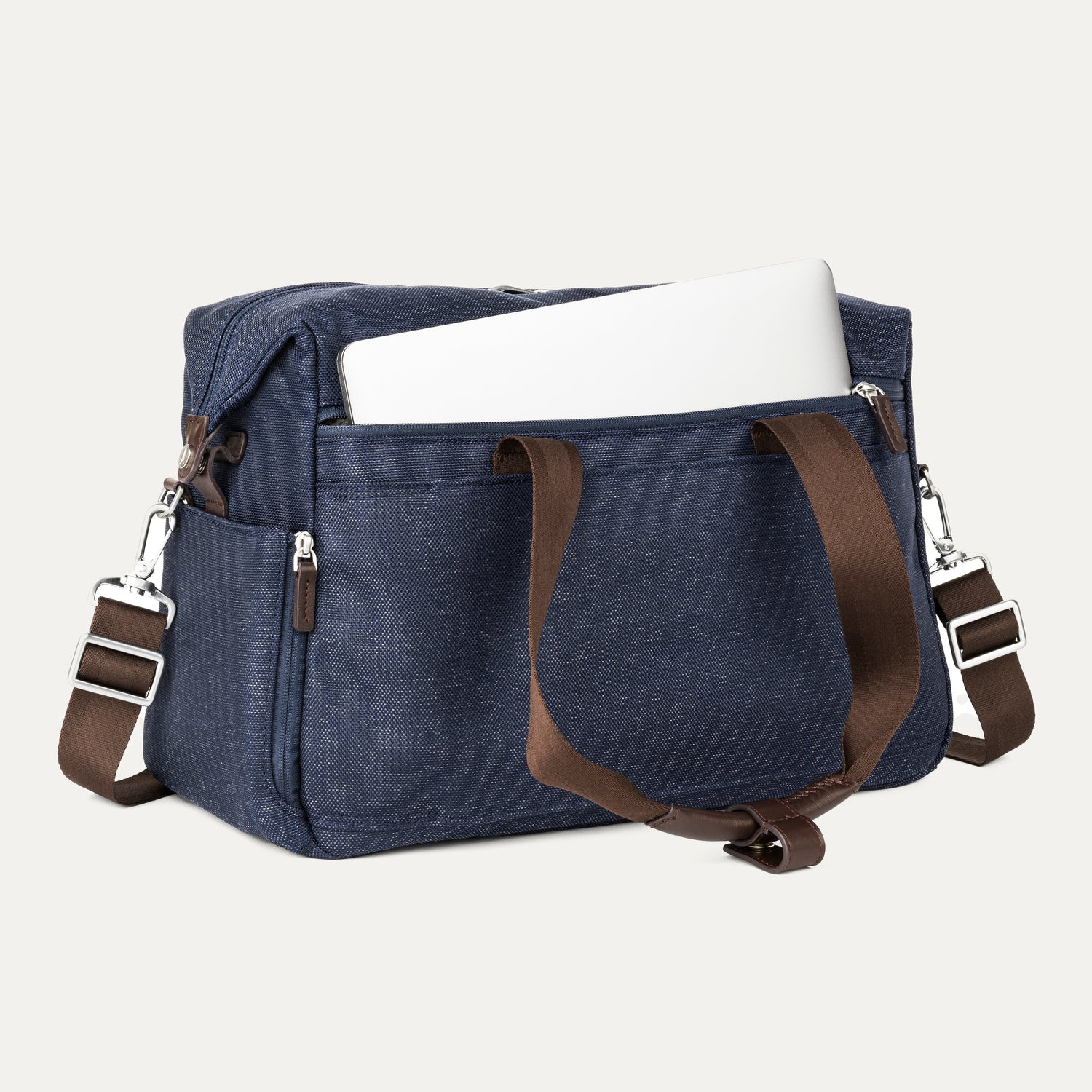 True navy tote with a laptop in the padded sleeve compartment on a white background 