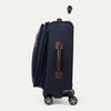 Side view of expanded blue suitcase with brown side handle on a white background