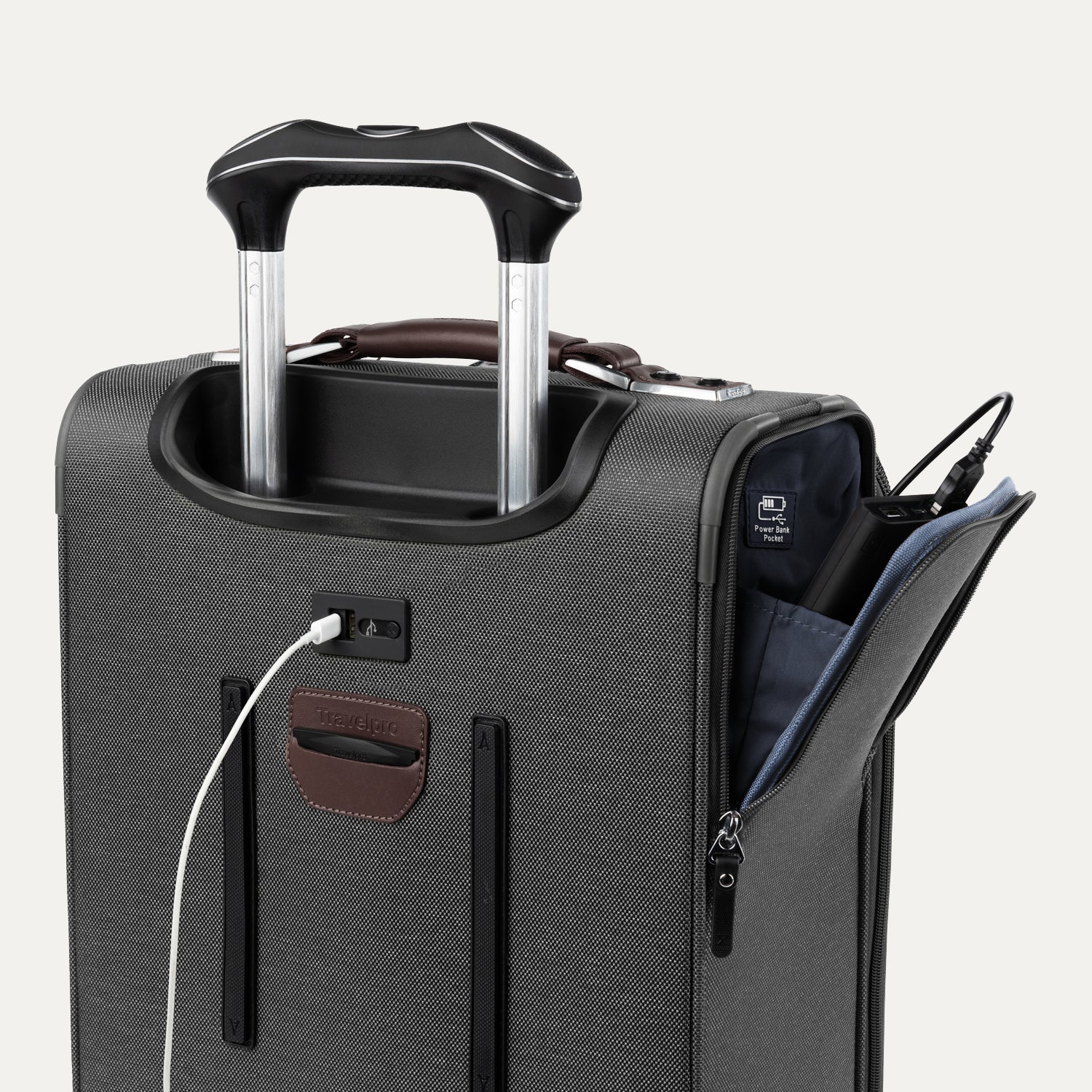 Gray suitcase with open power bank compartment on white background
