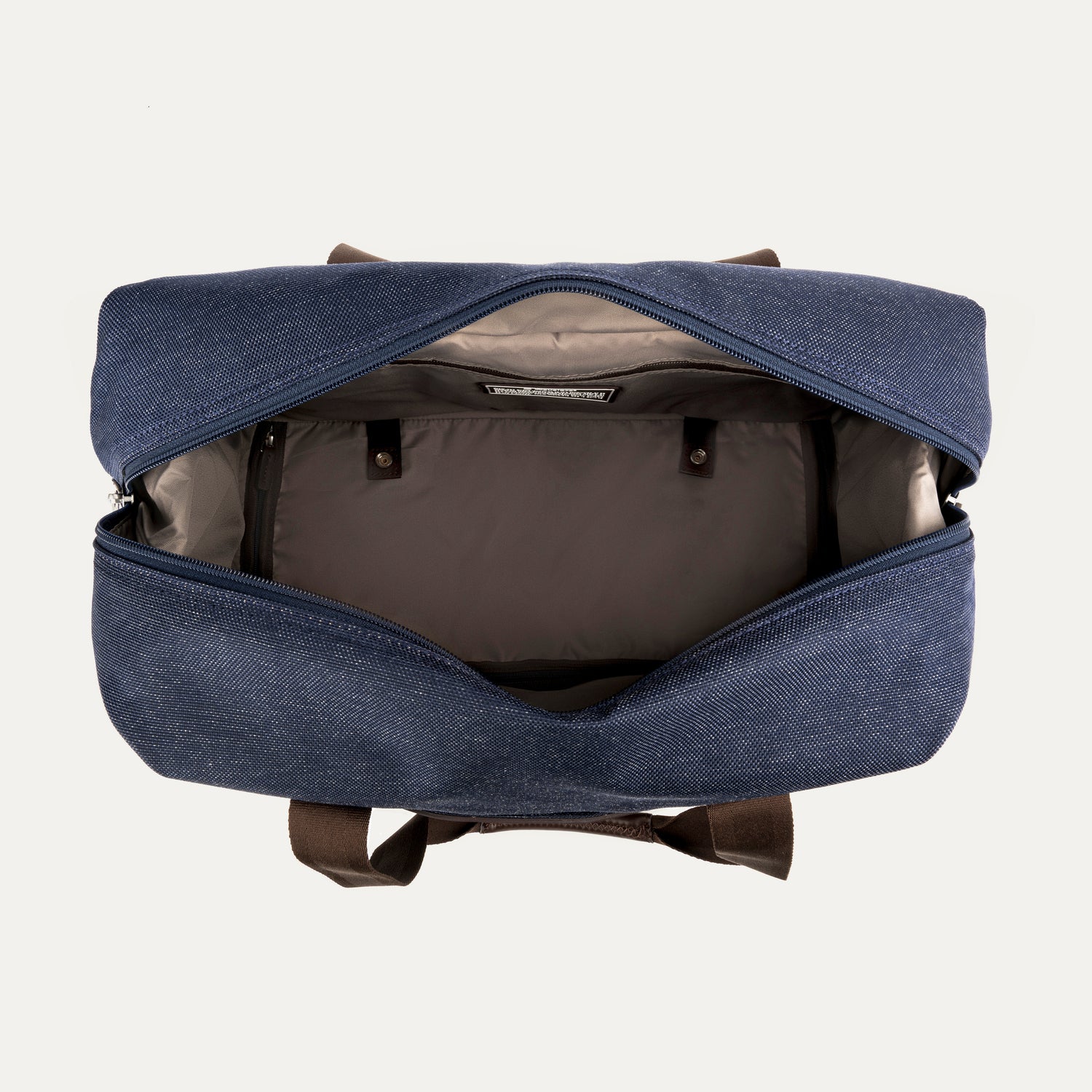 Blue weekender bag showing the interior  on a light gray background