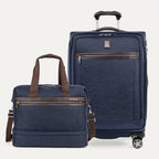 Two navy blue suitcases with brown accents on a light gray background