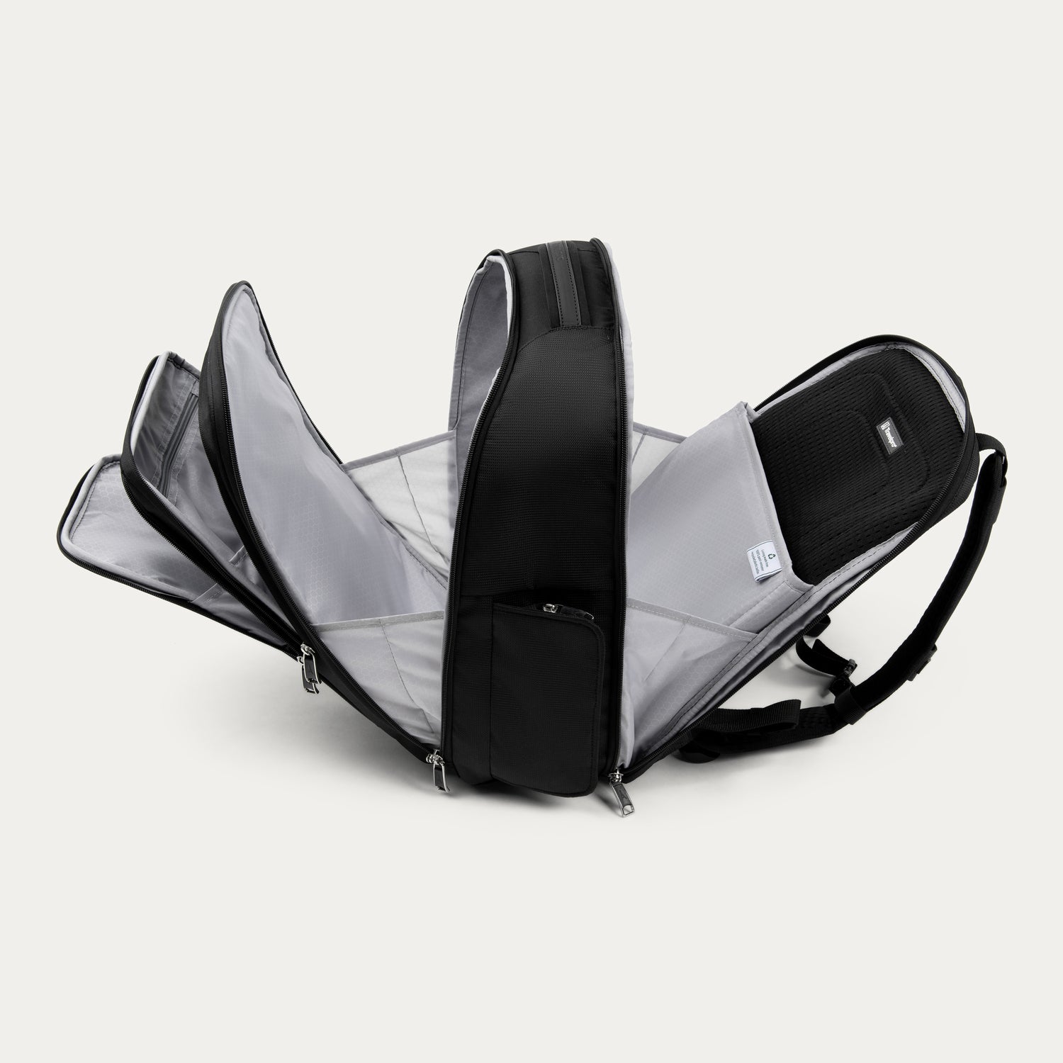 Black backpack with all the compartments open on a white background 