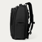Side view of black backpack on a white background