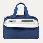 Blue tote bag with interior compartments on a light gray background