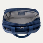 Blue tote bag with open lid on a light gray background