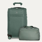 Green suitcase and travel bag set on a light gray background