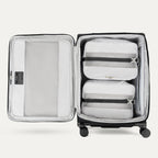 Open spinner suitcases in black , showing the interior compartments on a white background