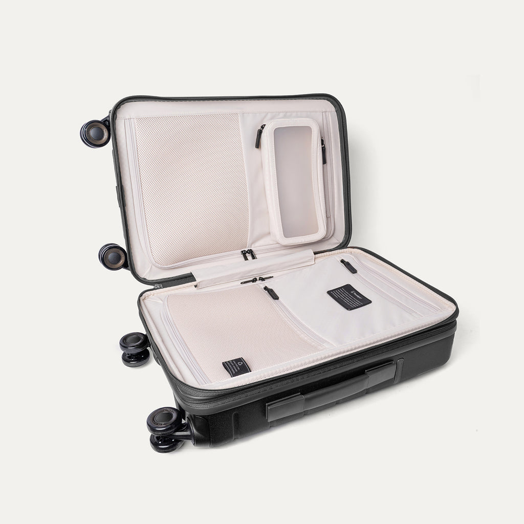 Open interior of the Compact Carry-On from the Travelpro Platinum Reserve Compact Carry-On / Medium Check-In Hardside Set in Black Dust showing the zippered divider panel