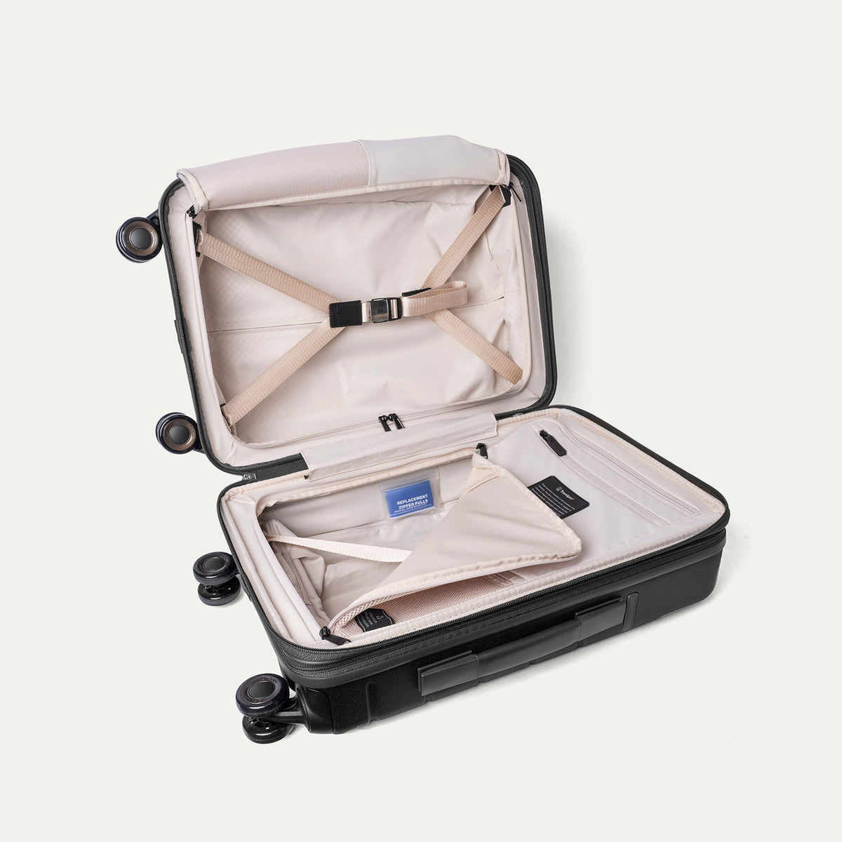 Open interior of the Compact Carry-On from the Travelpro Platinum Reserve Compact Carry-On / Medium Check-In Hardside Set in Black Dust with hold-down straps