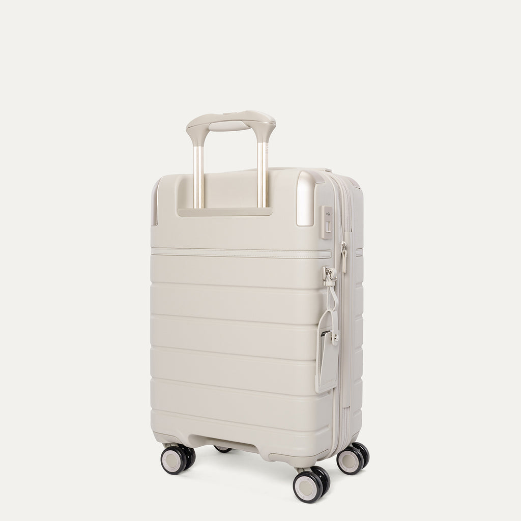 Rear angled view of the Compact Carry-On from the Travelpro Platinum Reserve Compact Carry-On / Medium Check-In Hardside Set in Sandstone