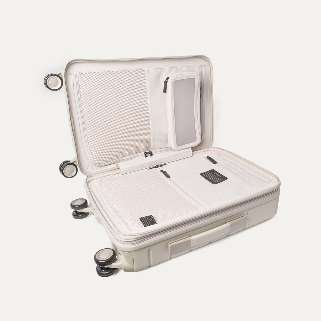 Open interior of the Compact Carry-On from the Travelpro Platinum Reserve Compact Carry-On / Medium Check-In Hardside Set in Sandstone showing the zippered divider panel