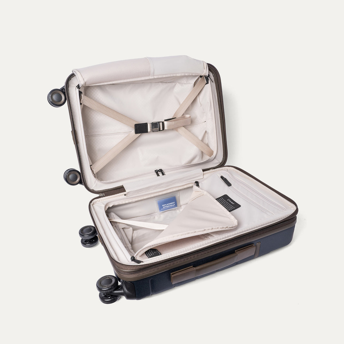 Open interior of the Compact Carry-On from the Travelpro Platinum Reserve Compact Carry-On / Medium Check-In Hardside Set in Midnight Trail with hold-down straps