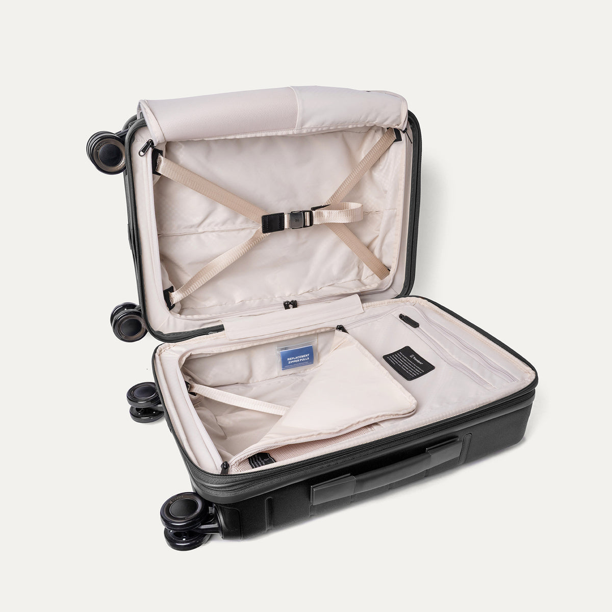 Open interior of the Carry-On from the Travelpro Platinum Reserve Carry-On / Medium / Large Hardside Set in Black Dust with hold-down straps