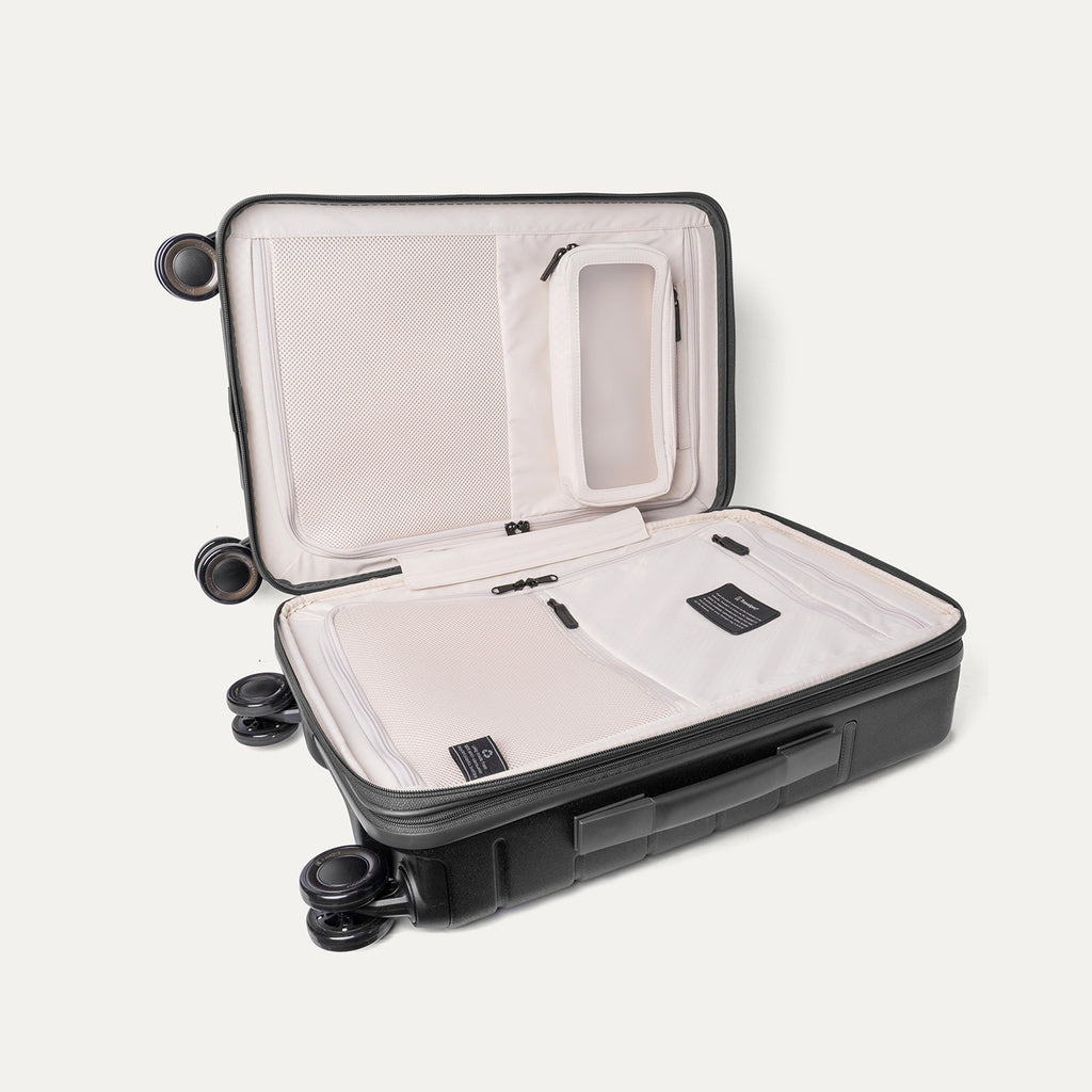 Open interior of the Carry-On from the Travelpro Platinum Reserve Carry-On / Large Check-In Hardside Set in Black Dust showing the zippered divider panel