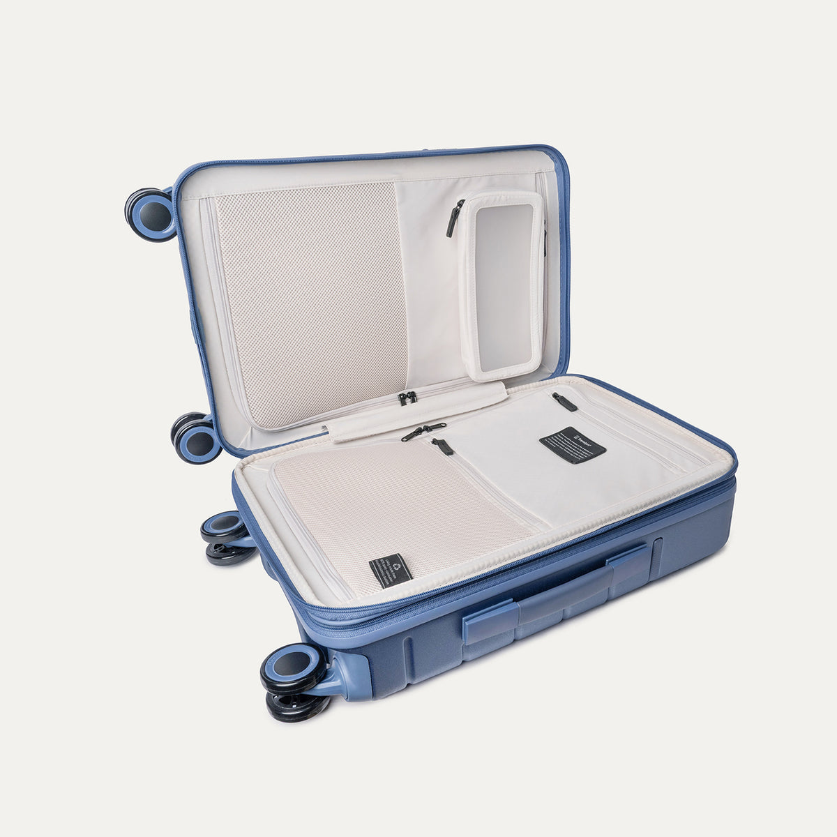 Open interior of the Carry-On from the Travelpro Platinum Reserve Carry-On / Medium Check-In Hardside Set in Steel Blue showing the zippered divider panel