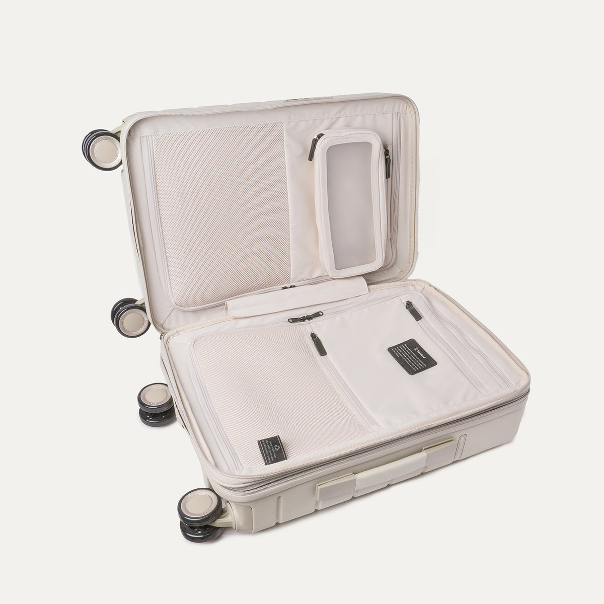 Open interior of the Carry-On from the Travelpro Platinum Reserve Carry-On / Medium / Large Hardside Set in Sandstone showing the zippered divider panel