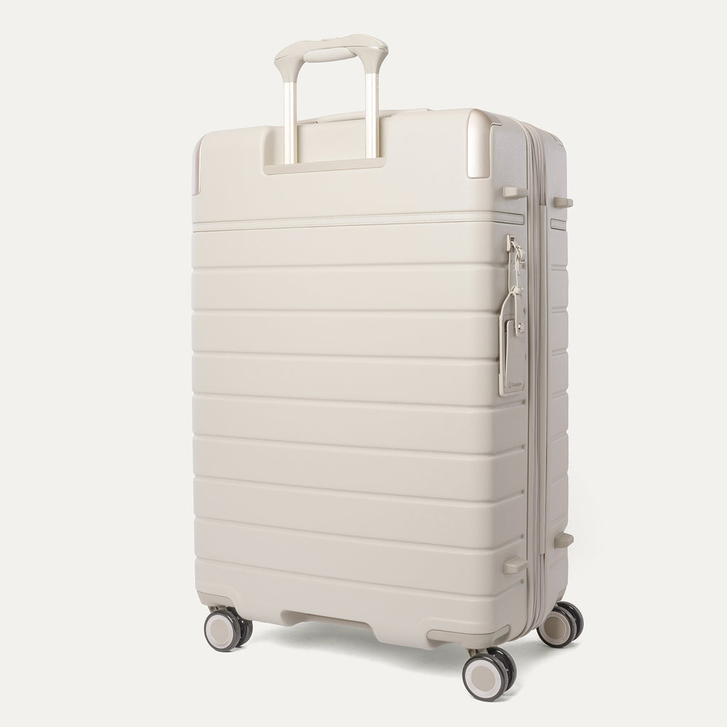 Rear angled view of the Large Check-In from the Travelpro Platinum Reserve Carry-On / Large Check-In Hardside Set in Sandstone