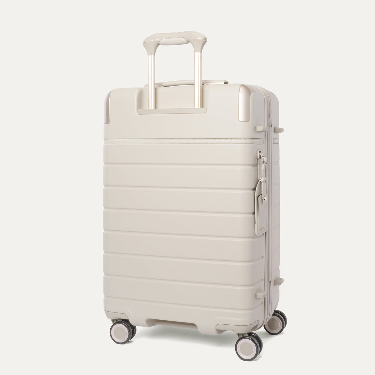 Rear angled view of the Medium Check-In from the Travelpro Platinum Reserve Carry-On / Medium Check-In Hardside Set in Sandstone