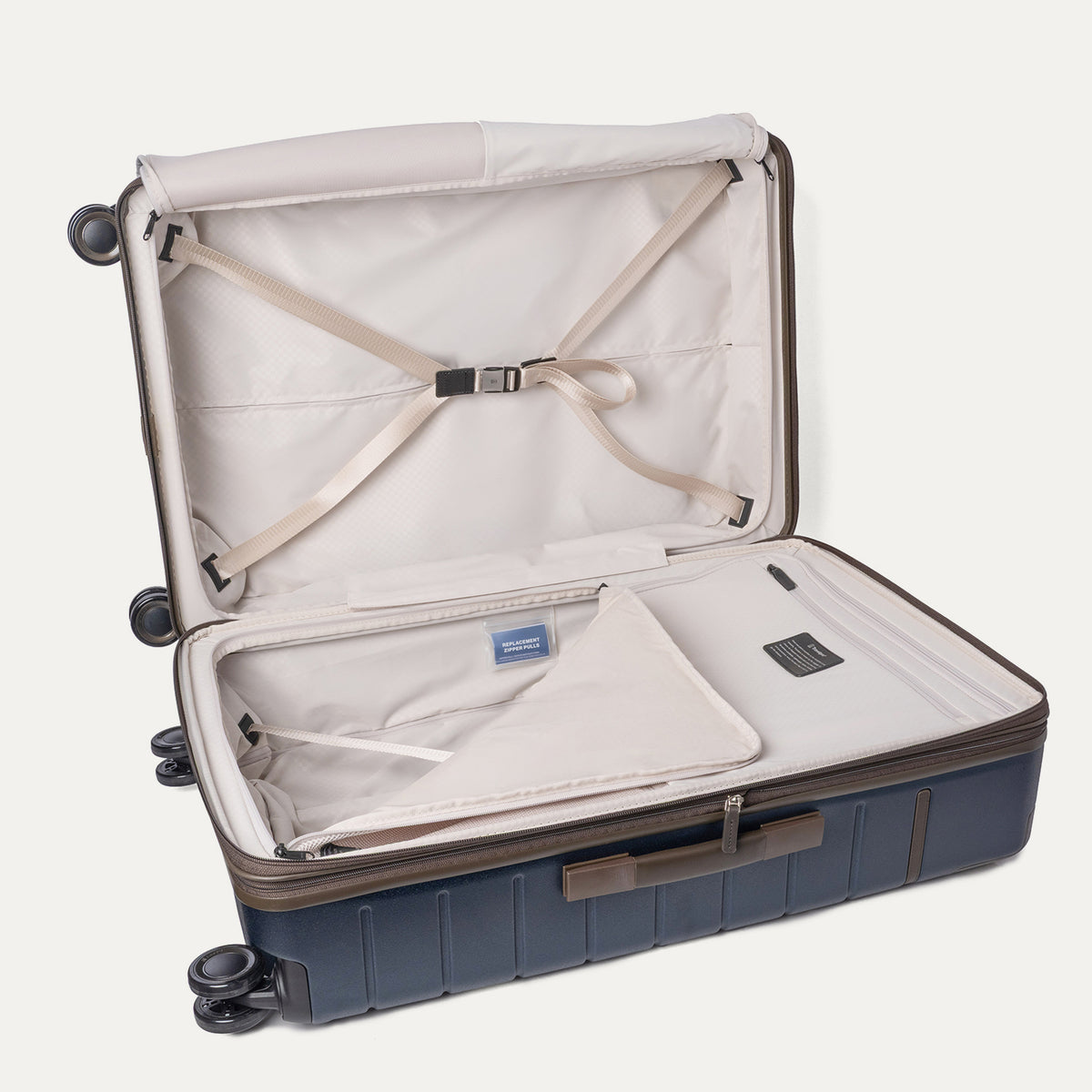 Open interior of the Large Check-In from the Travelpro Platinum Reserve Carry-On / Large Check-In Hardside Set in Midnight Trail with hold-down straps