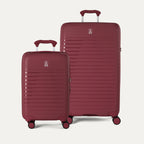Side-by-side view of the Optima Expandable Compact Carry-On and Large Check-In suitcases in Tibetan Red, displayed on a light gray background to highlight the size difference between the two pieces.