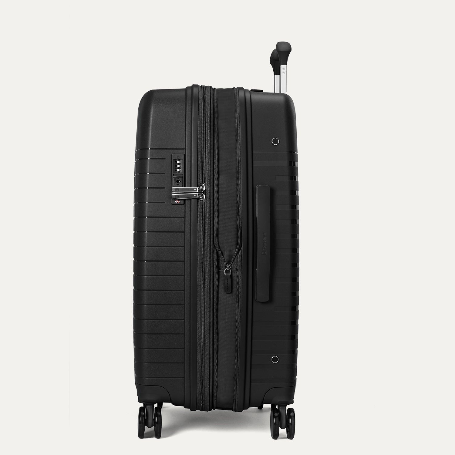 Side-profile view of the Optima Expandable Medium Check-In hardside spinner in Black, highlighting the expansion zipper, side-mounted TSA-approved combination lock, and sturdy side carry handle.