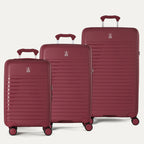 Side-by-side view of the Optima Expandable Carry-On, Medium, and Large Check-In suitcases in Tibetan Red, displayed on a light background to highlight the size difference across the three-piece set.