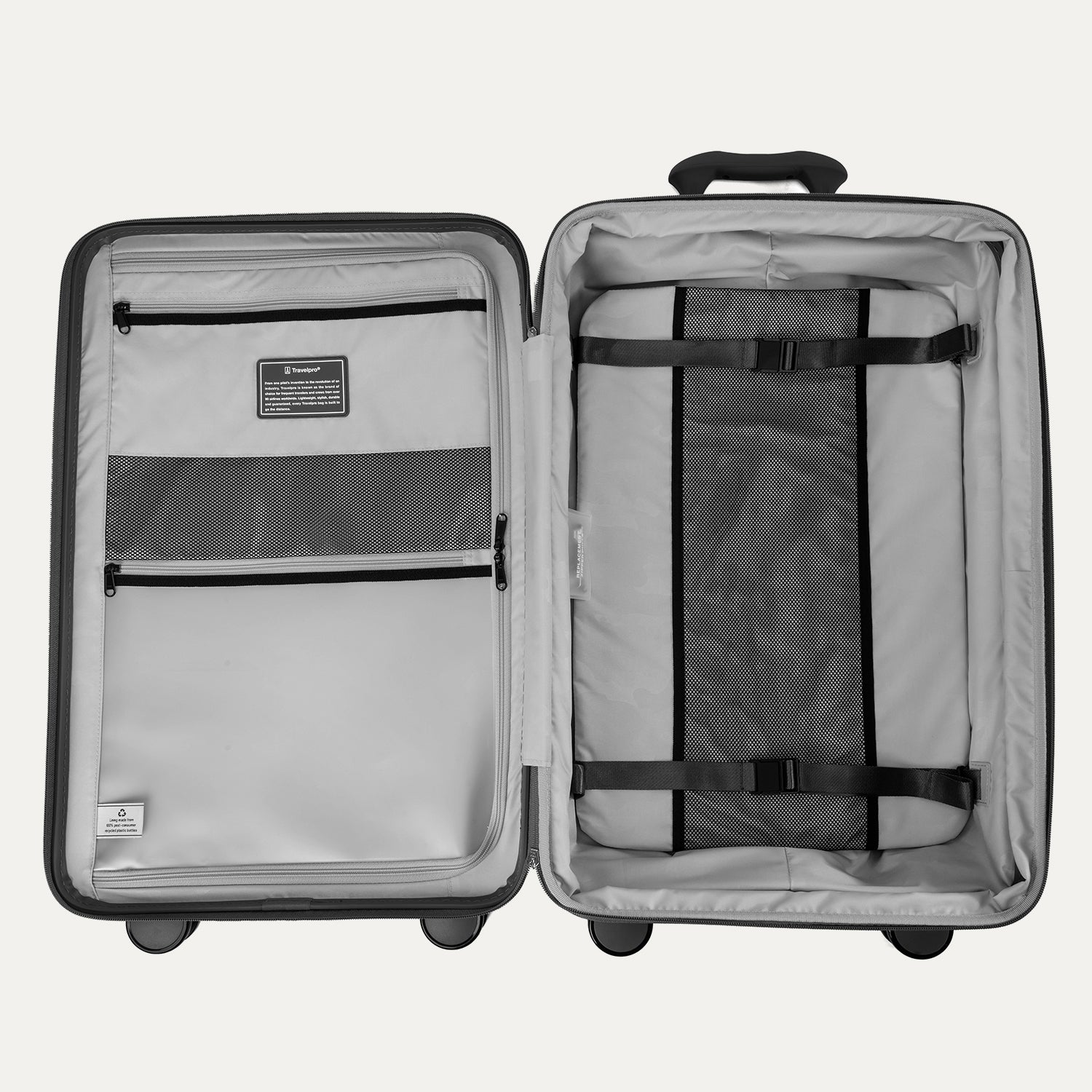 Interior view of the open Optima Expandable Medium Check-In suitcase in Black, showcasing the spacious split-case design with zippered mesh divider panels, compression straps, and interior accessory pockets.