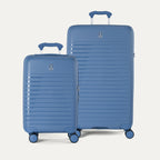 Side-by-side view of the Optima Expandable Carry-On and Large Check-In suitcases in Horizon Blue, displayed on a neutral background to highlight the size difference across the two-piece set.