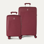 Side-by-side view of the Optima® Expandable Carry-On and Large Check-In suitcases in Tibetan Red, displayed on a neutral background to highlight the size difference across the two-piece set.