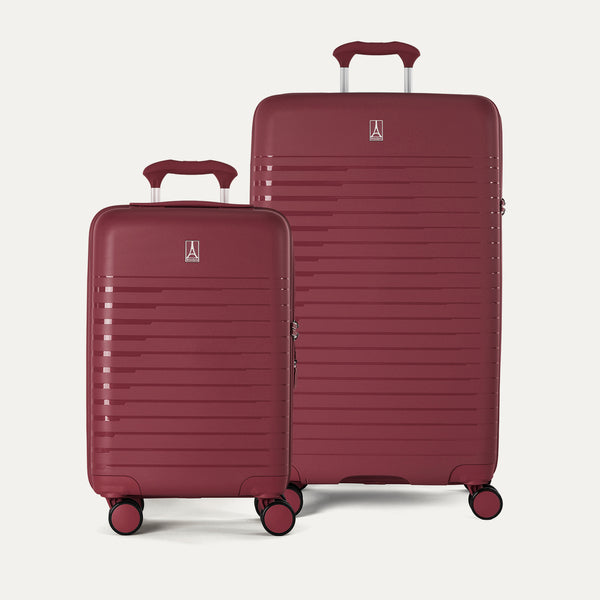 Side-by-side view of the Optima® Expandable Carry-On and Large Check-In suitcases in Tibetan Red, displayed on a neutral background to highlight the size difference across the two-piece set.