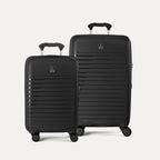 Side-by-side view of the Optima Expandable Compact Carry-On and Medium Check-In suitcases in Black, displayed on a light gray background to highlight the size difference between the two pieces.