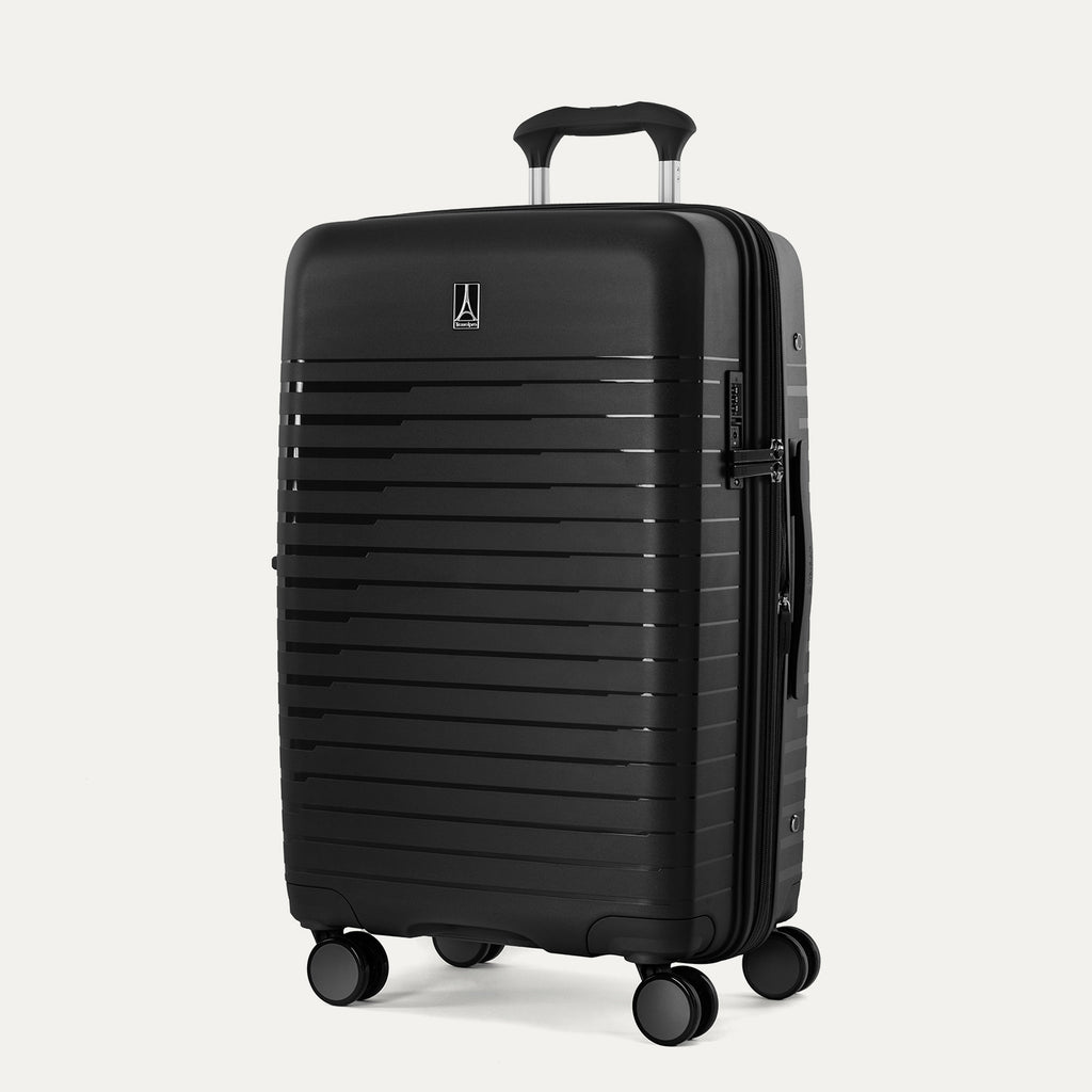 Front-facing view of the Optima Expandable Medium Check-In hardside spinner in Black, showcasing the durable textured exterior, centered brand logo, and smooth-rolling spinner wheels.