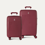 Two suitcases from the Optima Expandable Compact Carry-On and Medium Check-In set in Tibetan Red, displayed side-by-side on a light gray background to show the size difference.