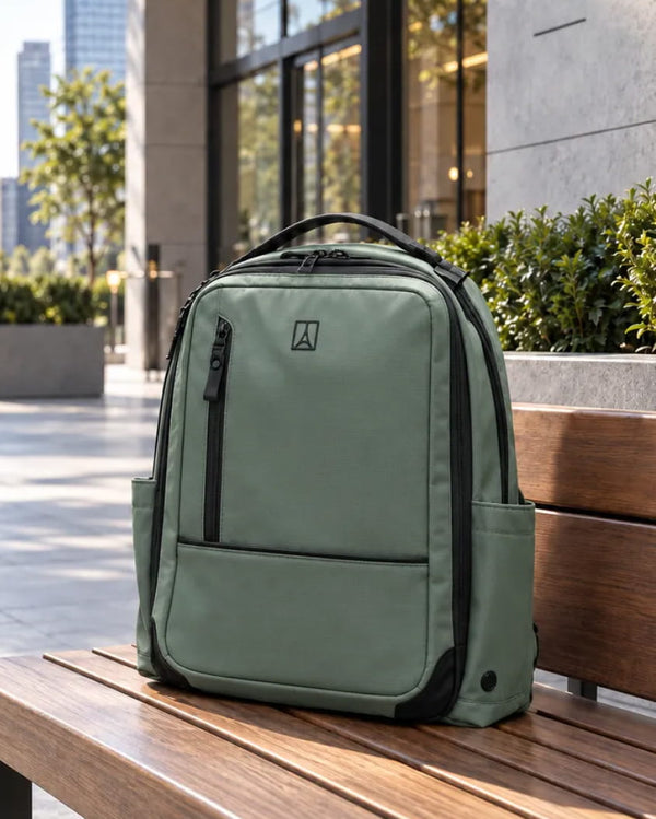 Altitude backpack in Field Green on a sunny city bench
