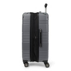 Side view of Travelpro Roundtrip Hardshell Medium Check‑In Suitcase in Gunmetal Gray, showing textured hardshell design, expansion zipper open, black telescoping handle, and four spinner wheels against white background.