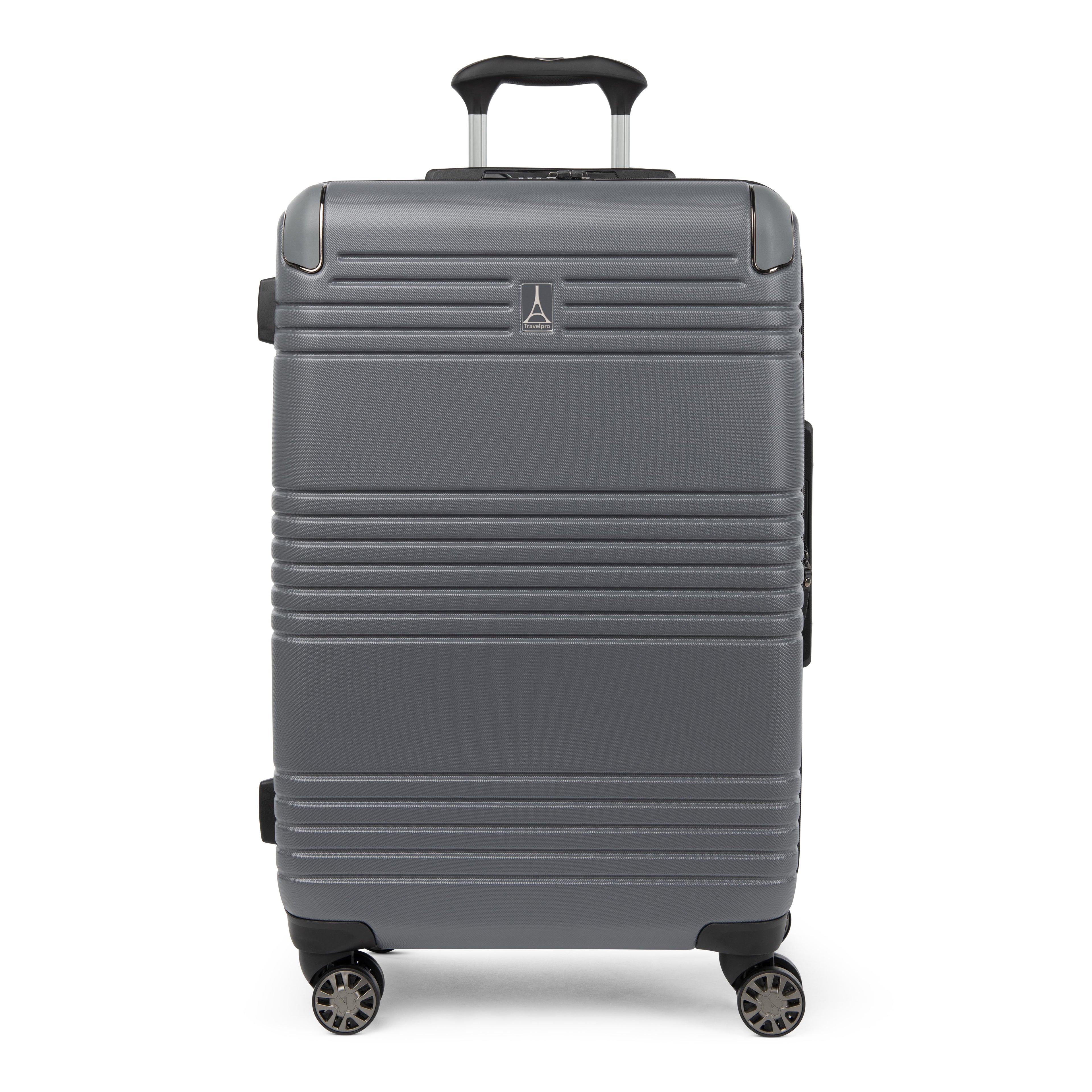 Front view of the Travelpro Roundtrip Medium Check-In Expandable Spinner in Gunmetal Gray, showing textured hardshell design with horizontal ridges, a small metallic logo, and four multi-directional wheels against a clean white background.