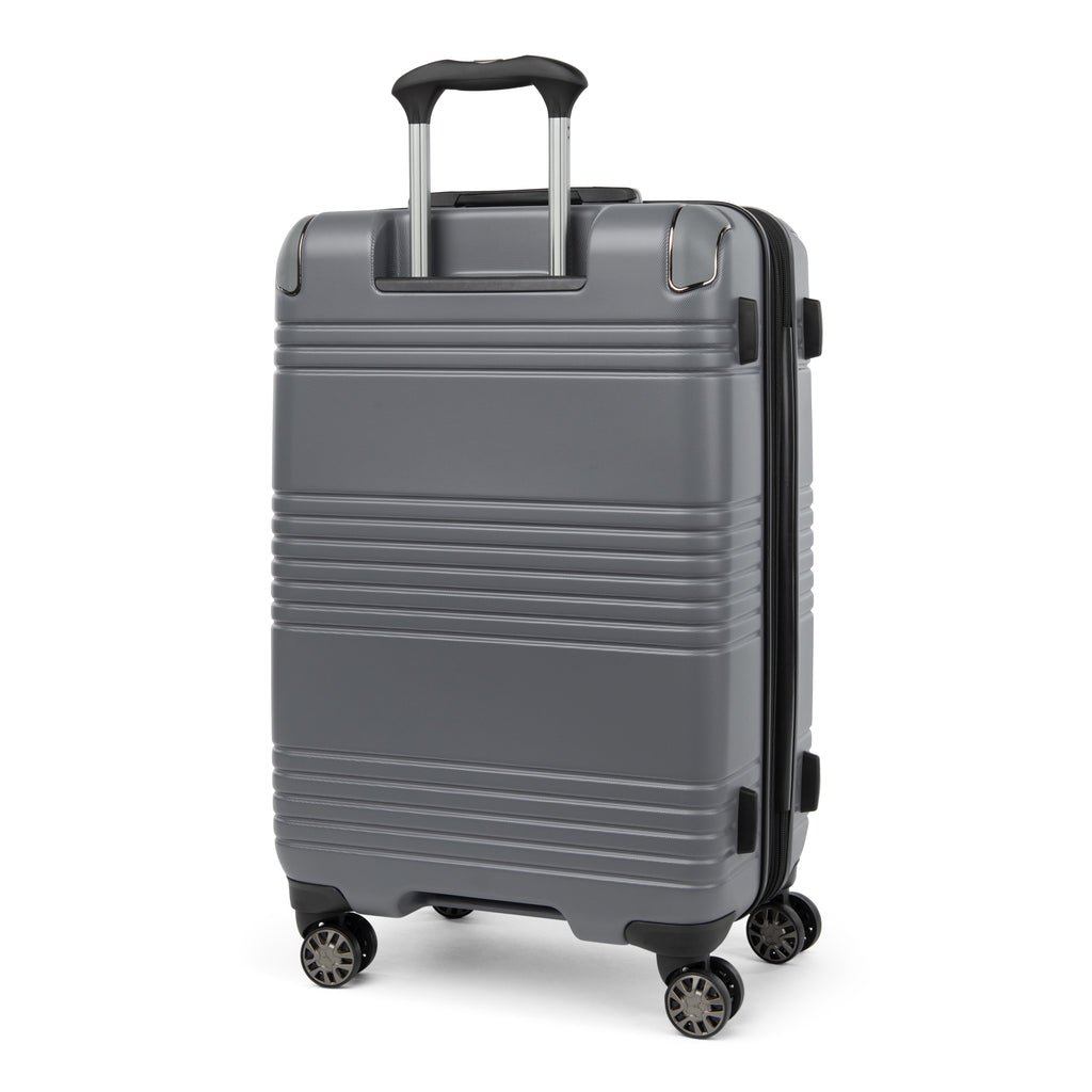Rear view of the Travelpro Roundtrip Medium Check-In Expandable Spinner in Gunmetal Gray, showing the textured hardshell design with horizontal ridges, black telescoping handle, and four multi-directional wheels against a clean white background.