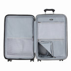 Interior view of the Travelpro Roundtrip Medium Check-In Expandable Spinner in Gunmetal Gray, showing the dual-compartment design with zippered mesh dividers and adjustable packing straps against a white background.