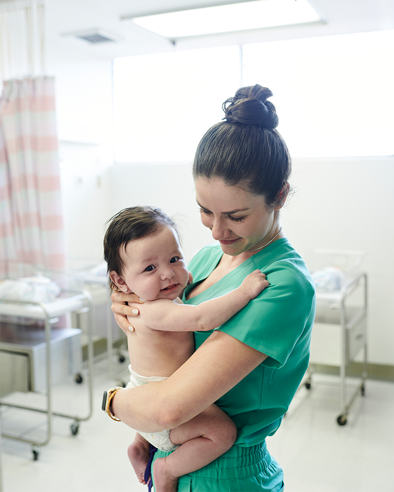 Nurse Chandler Rosemont holding Baby