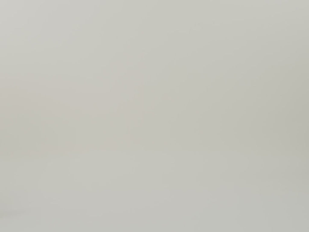 Man walking in putting tote on top of suitcase and walking out