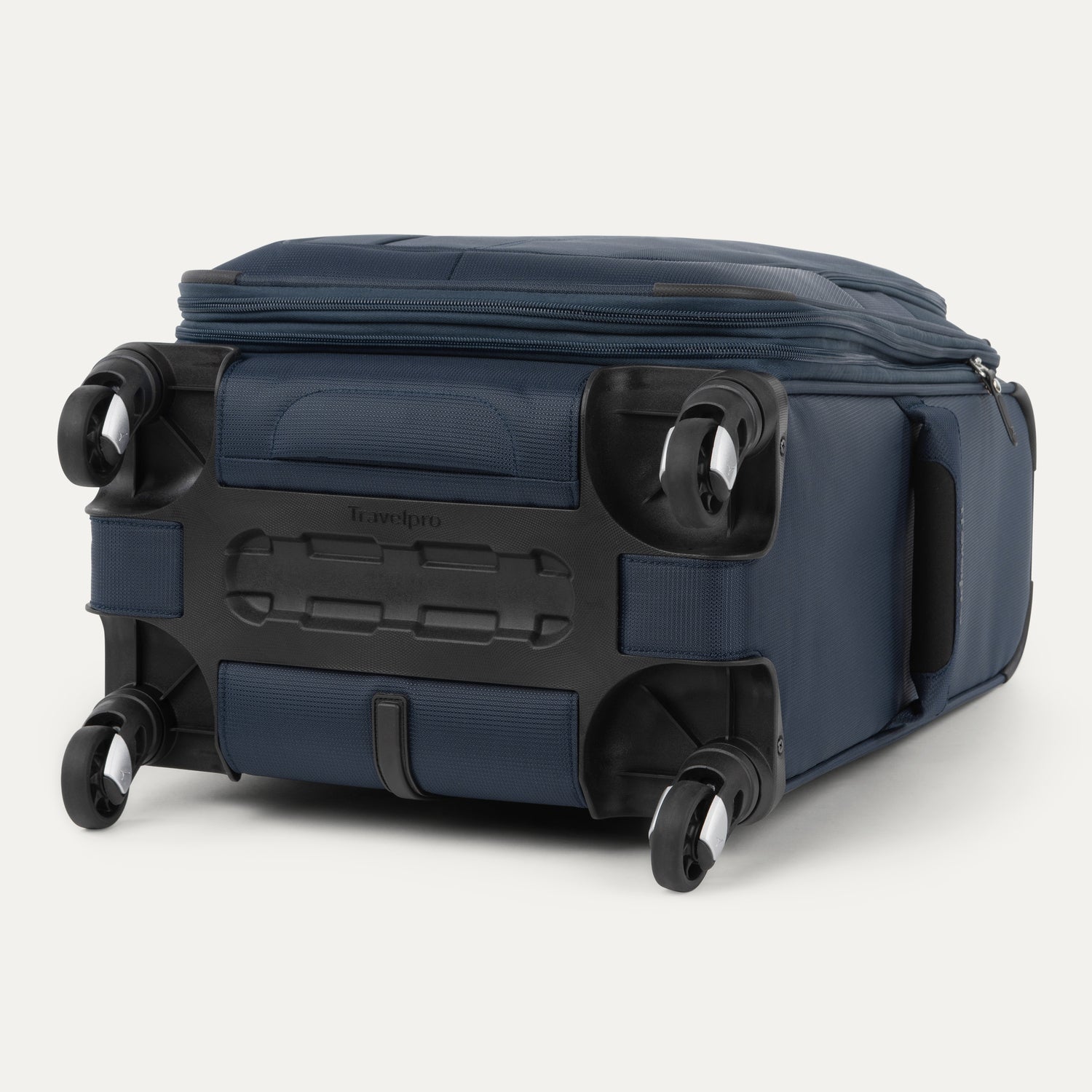 bottom view of the midnight blue travelpro maxlite® 5 carry-on spinner, showing the four 360-degree spinner wheels, the protective plastic bottom molding with the travelpro logo, and the durable fabric base.