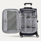 interior view of the open midnight blue travelpro maxlite® 5 carry-on spinner, showing the lightweight grey lining, a large zippered mesh lid pocket, and adjustable hold-down straps to keep contents secure.
