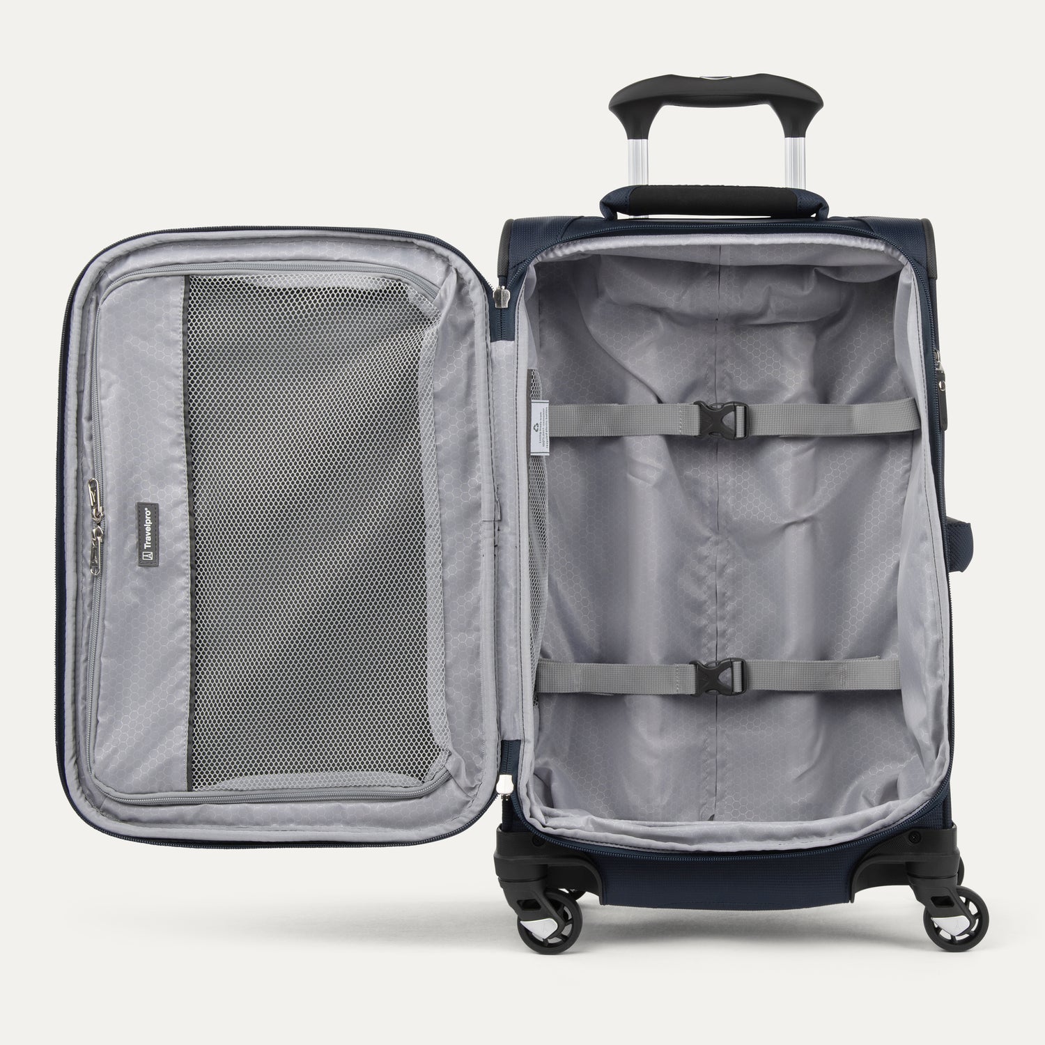 interior view of the open midnight blue travelpro maxlite® 5 carry-on spinner, showing the lightweight grey lining, a large zippered mesh lid pocket, and adjustable hold-down straps to keep contents secure.